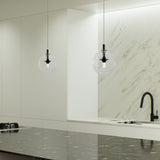 VONN Portofino 7" LED Pendant with Glass Ball Shade VAP2161AB over modern kitchen island