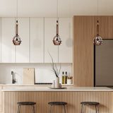 VONN Artisan Bari 7-inch LED Black Pendant with leather strap over kitchen island