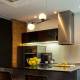 VONN Artisan Chianti 43" Integrated LED Pendant in Antique Brass VAC3122AB hanging in the kitchen