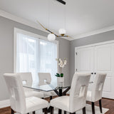 VONN Artisan Chianti 43" Integrated LED Pendant in Antique Brass in the contemporary dining room