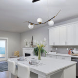 VONN Chianti 54" LED Chandelier with 3 Glass Shades VAC3123AB Antique Brass over a kitchen table