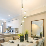 VONN Artisan Amalfi 5-Light LED Pendant VAC3215GL over a dining room table