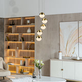 VONN Ravello 5-Light LED Pendant VAC3285BRS over a living room table