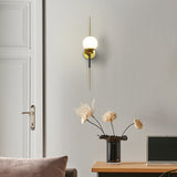 VONN Chianti 30-inch Antique Brass Wall Sconce in the contemporary room