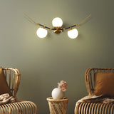 VONN Chianti 39-inch 3-Light Antique Brass Wall Sconce n the living room