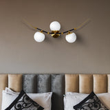 VONN Chianti 39-inch 3-Light Antique Brass Wall Sconce over the couch
