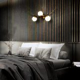 VONN Chianti 39-inch 3-Light Antique Brass Wall Sconce over the bed