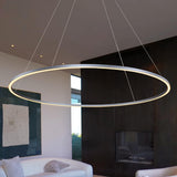 VONN Tania 60-inch Silver LED Ring Chandelier hovering in modern office