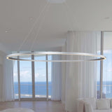 VONN Tania 60-inch Silver LED Ring Chandelier hovering in modern apartment