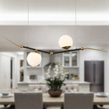 VONN Artisan Chianti 43" Integrated LED Pendant in Antique Brass VAC3122AB in the dining room setting